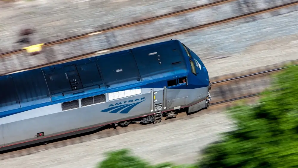An aerial view of a train moving fast